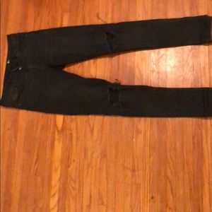 Black distressed at the knee jeans